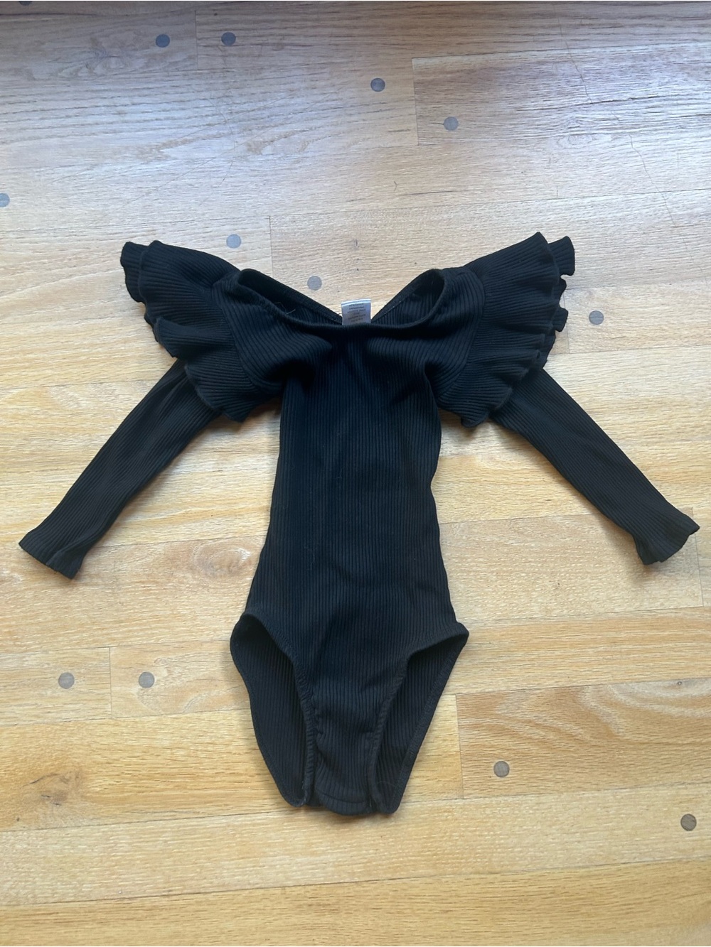 Ribbed Black Long-Sleeve Ruffle Shoulder Kids One-Piece Bodysuit